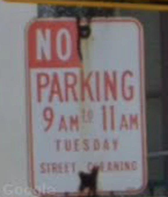 Street View crop of a Los Angeles sweeping sign: No Parking, 9am to 11am, Tuesday, Street Cleaning.